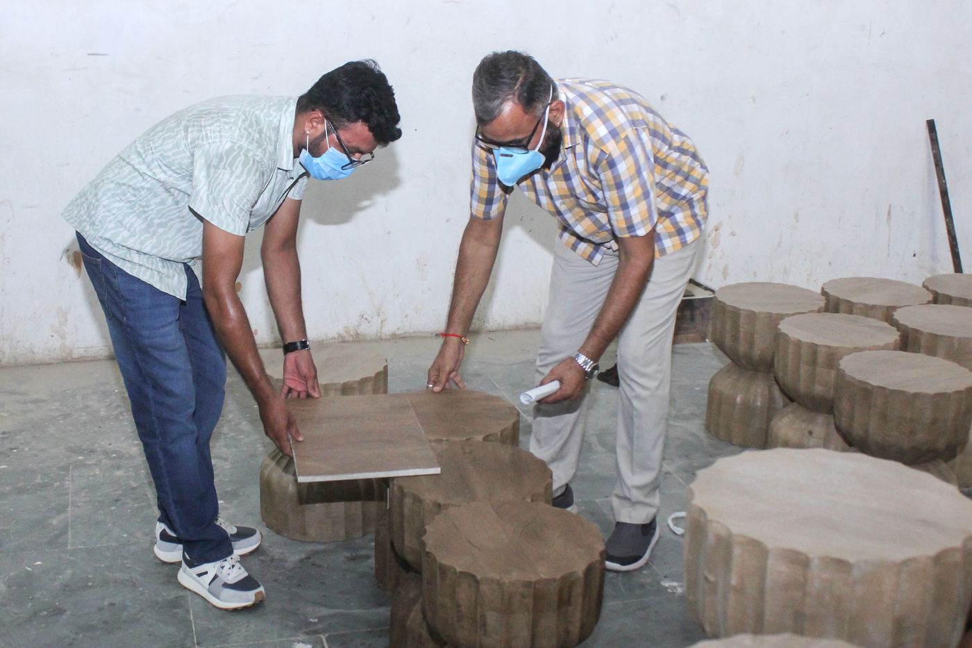 7SOURCE INTL team inspecting furniture at an Indian factory